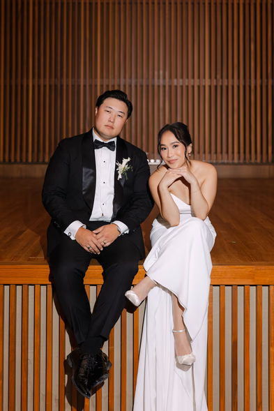 Bride and groom posing at Aga Khan Museum