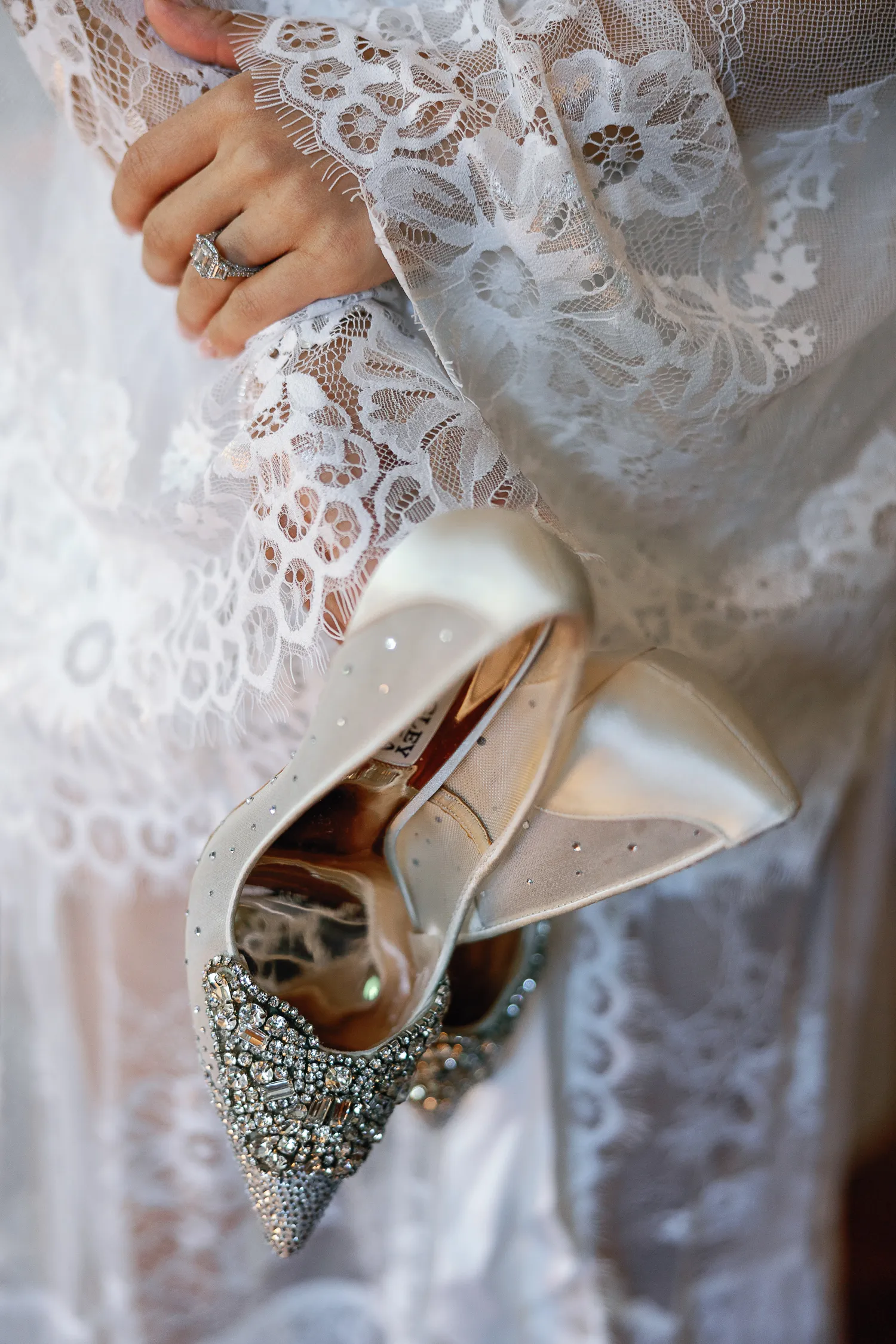 Bride holding the shoes