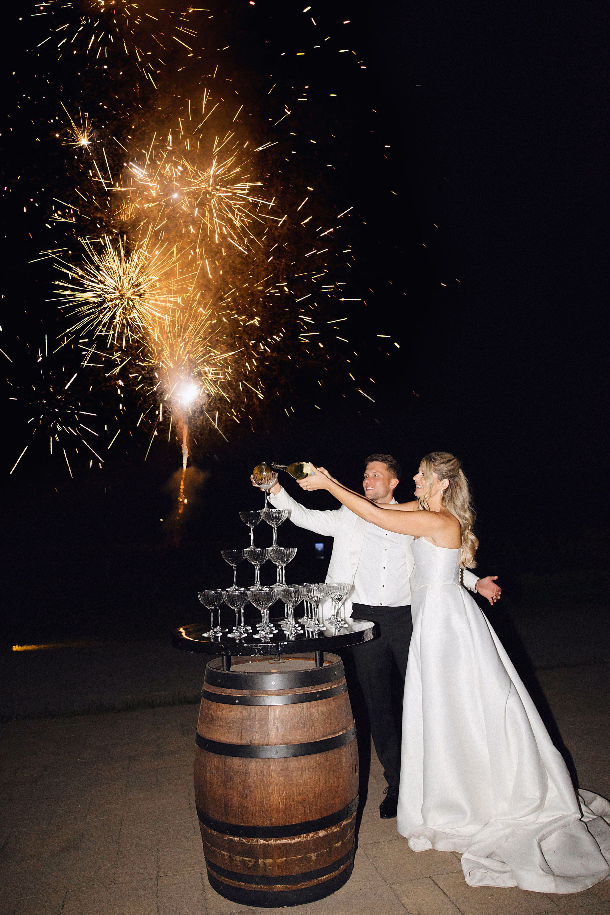 pooring champagne during wedding reception at Chateau des Charmes winery in Niagara-on-the-Lake