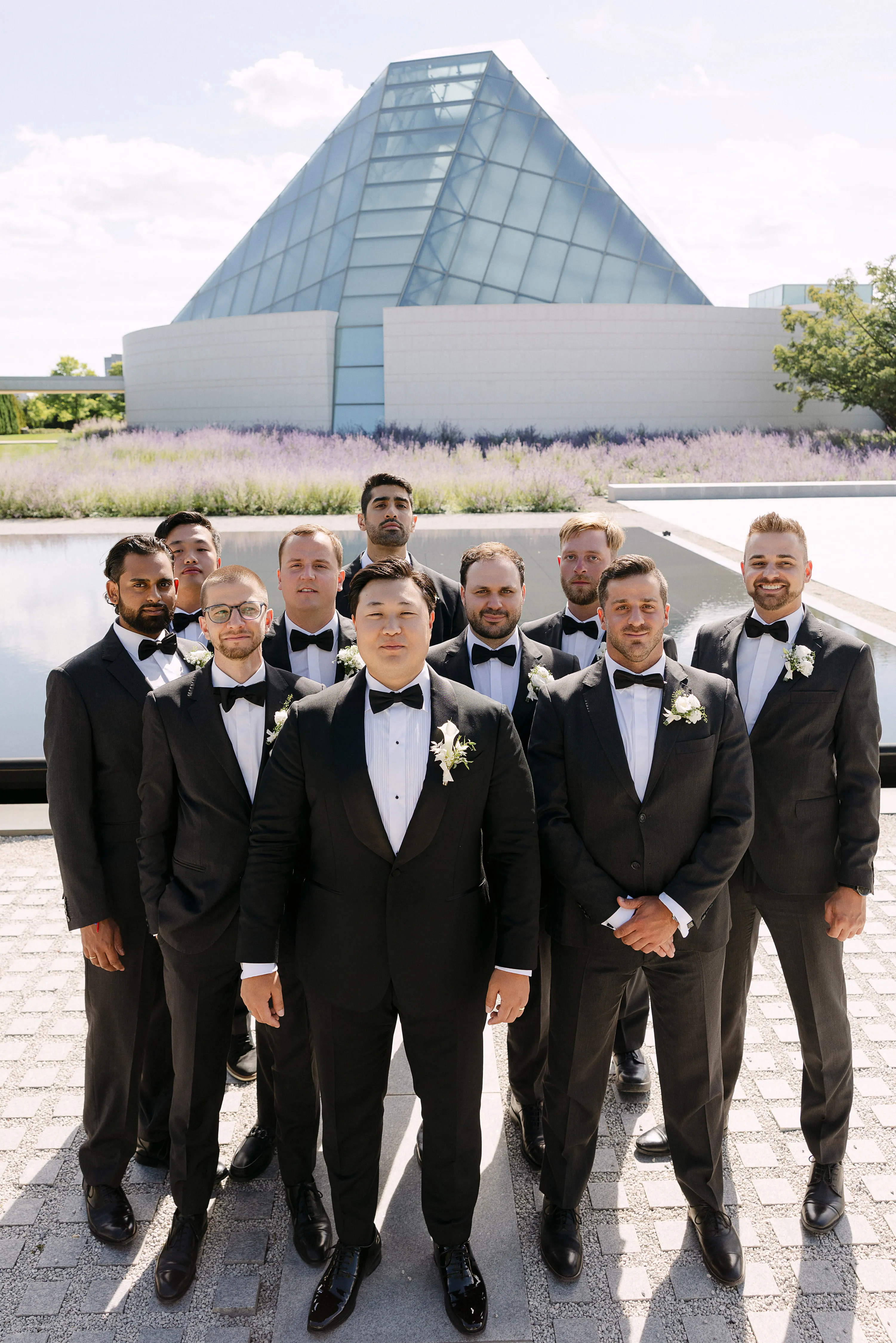 Groom posing with groomsmen at Aga Khan Museum wedding