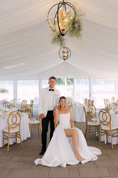 Elegant reception setup at Niagara-on-the-Lake winery wedding with bride and groom