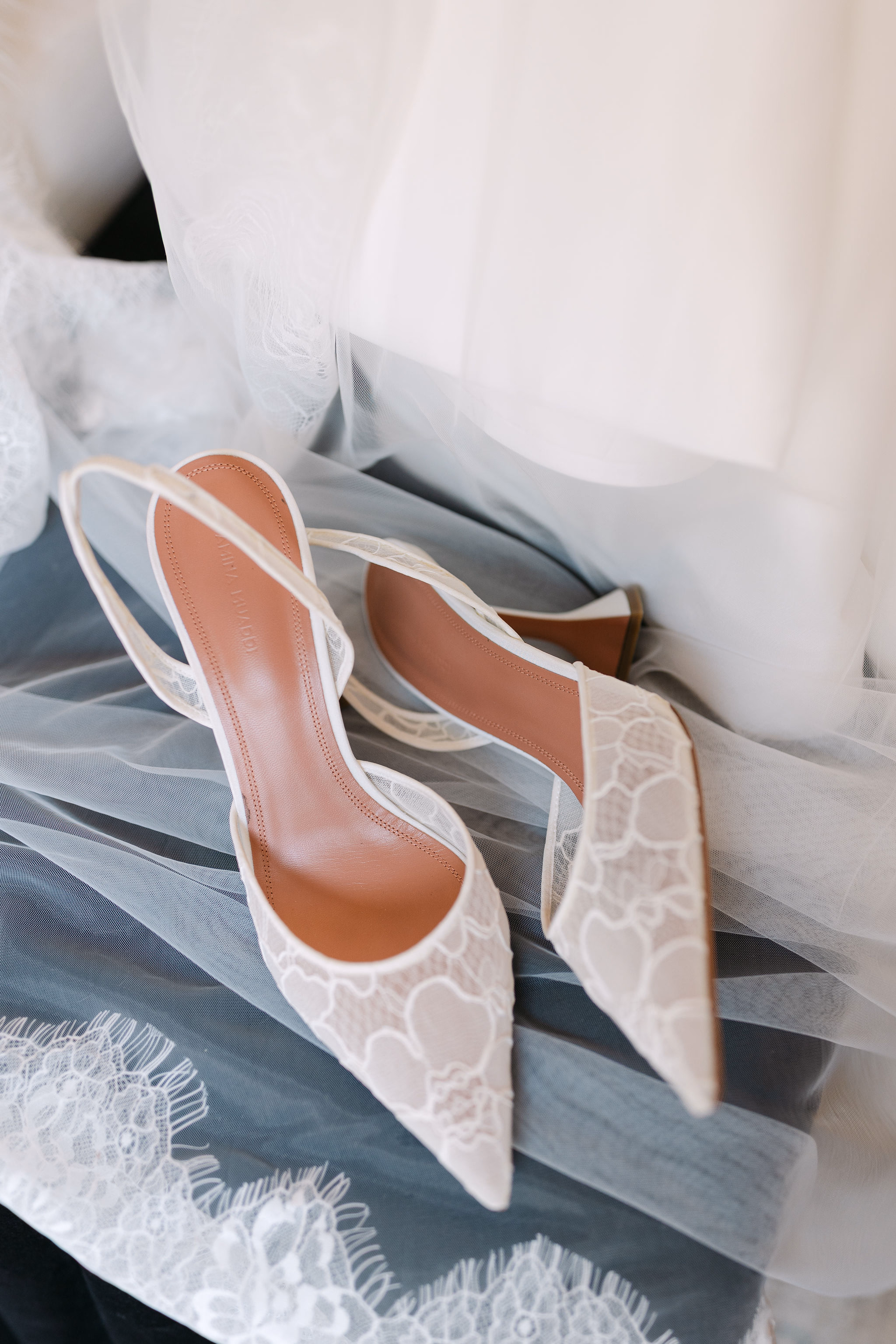 wedding details flat lay with shoes and veil at Chateau des Charmes wedding