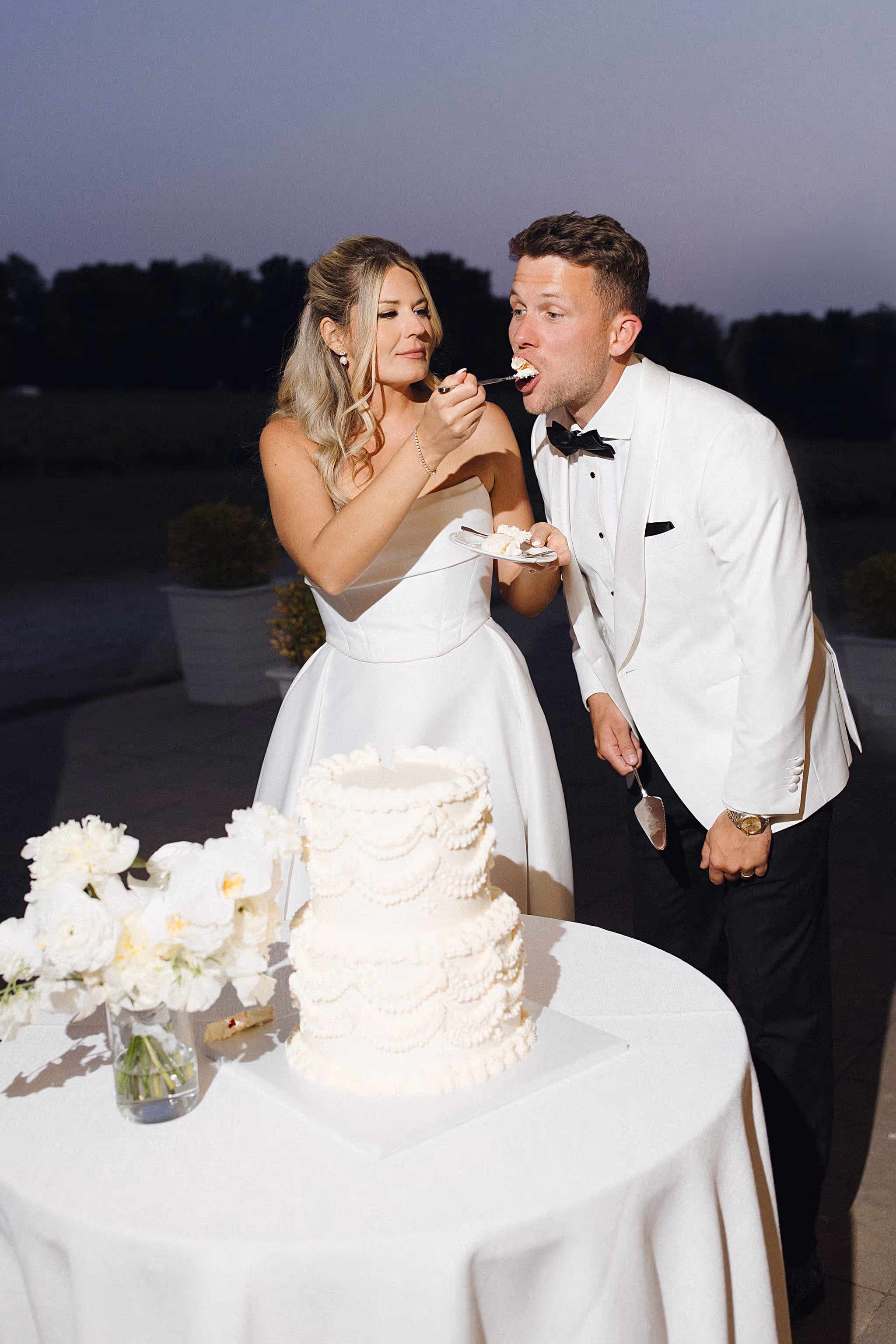 cake cutting at Chateau des Charmes wedding reception with bride and groom