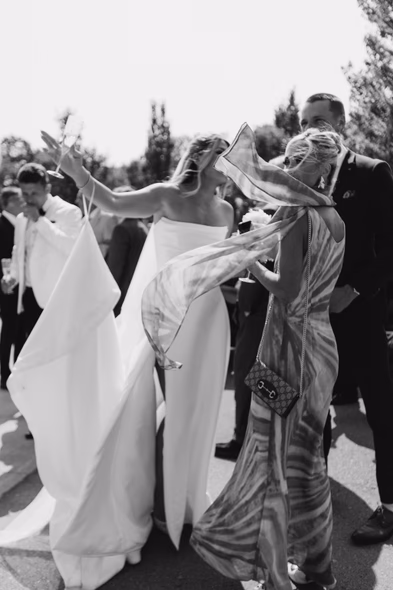 Bride and bridesmaids celebrating outdoors at Niagara-on-the-Lake winery wedding