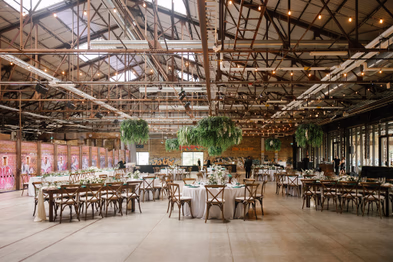 groom posing with bride at Evergreen Brickworks