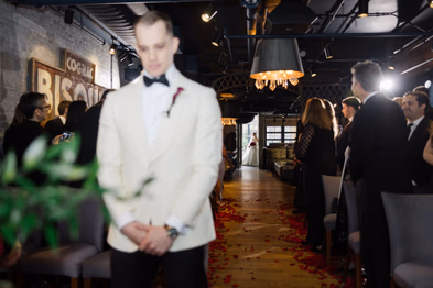 Wedding at George Restaurant Toronto groom in black tuxedo