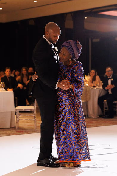 groom and mother dancing at Hotel X
