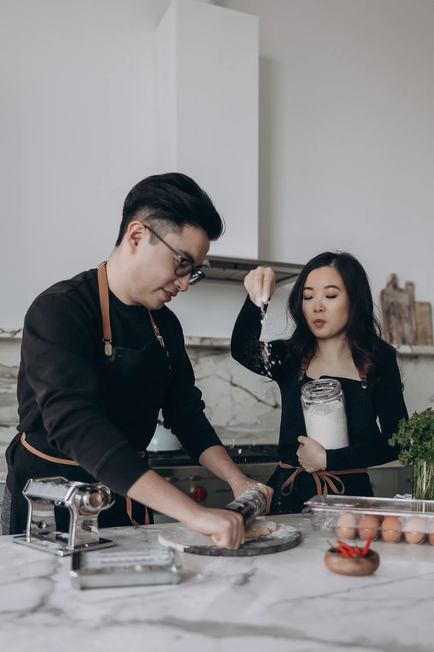 making pasta engagement photo
