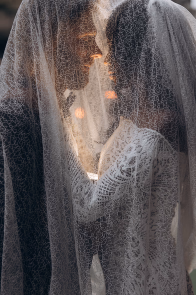 bride and groom under the veil