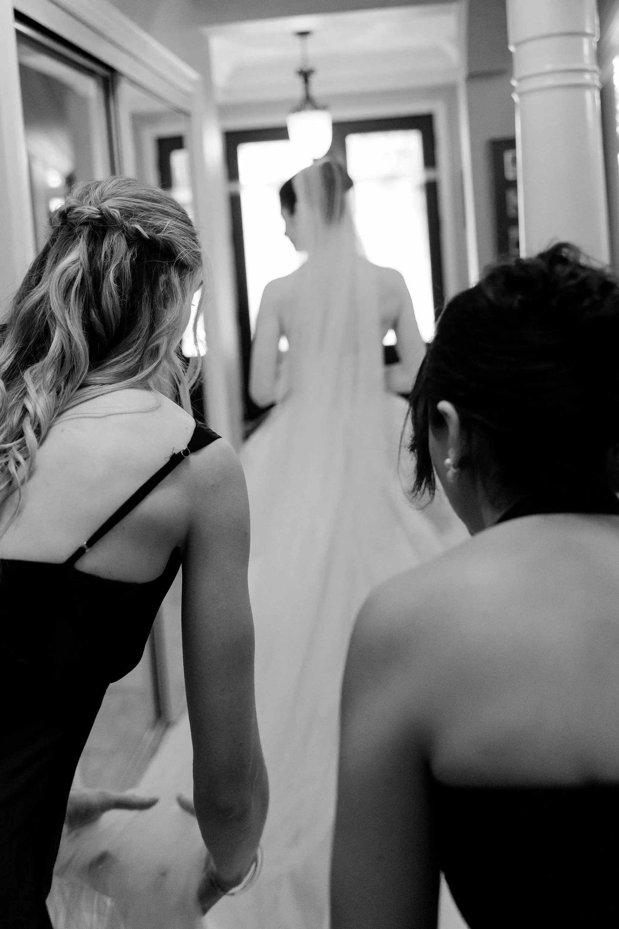 artistic portrait of the bride with bridesmaids