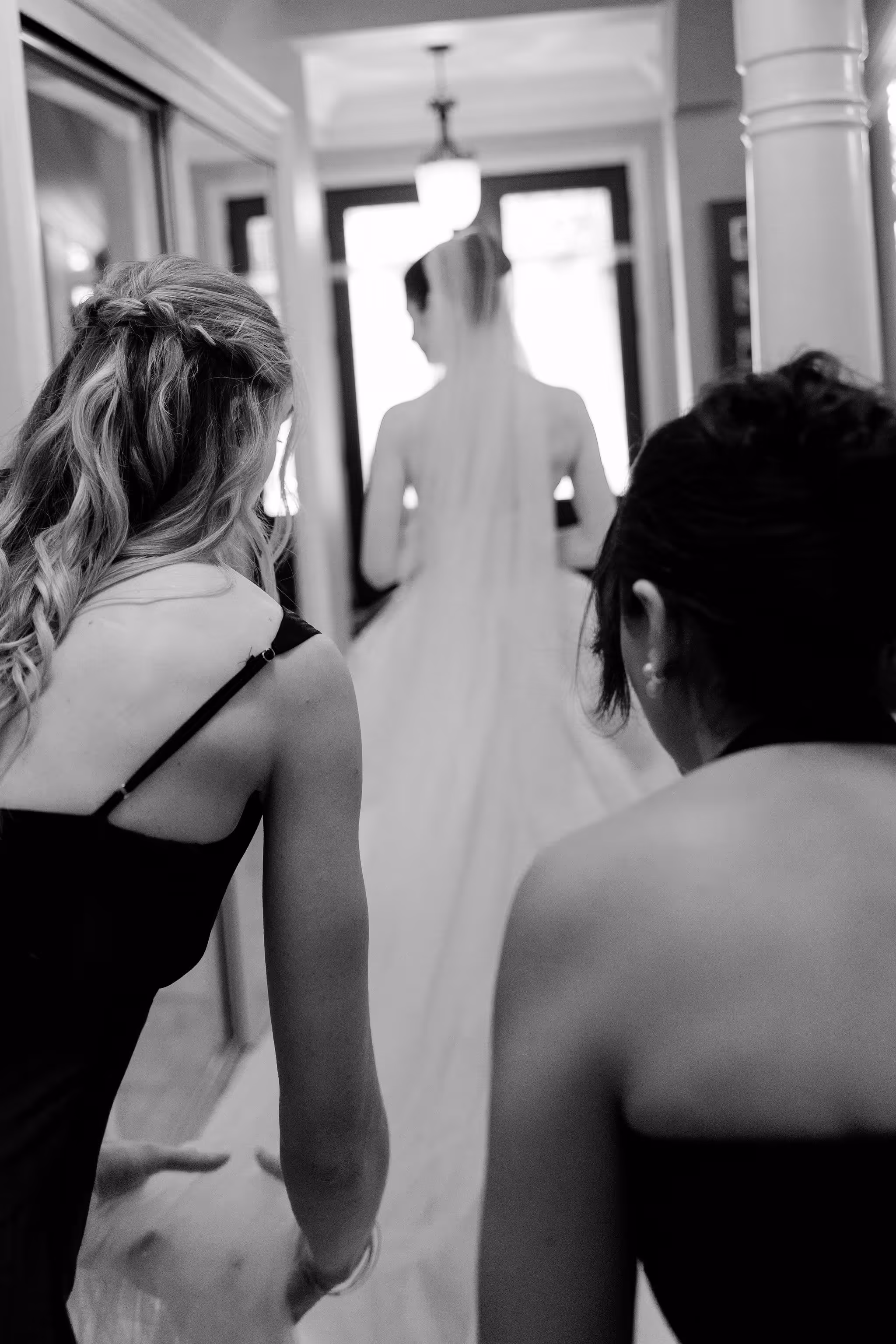 artistic portrait of the bride with bridesmaids