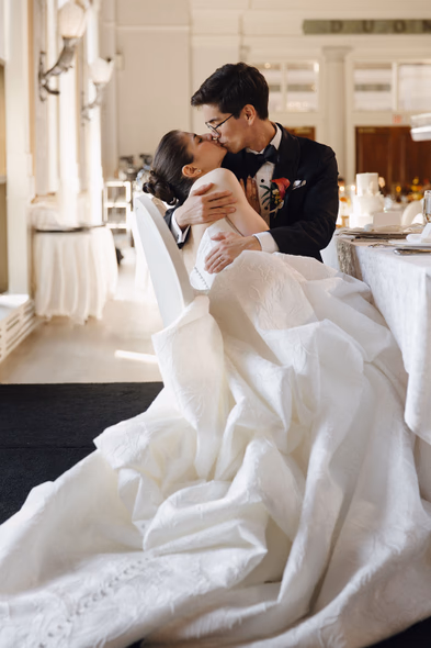 Bride and groom kissing at the reception at Liberty Grand