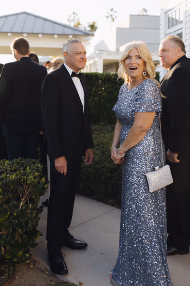 Elegant wedding guests smiling at Lido House Newport Beach