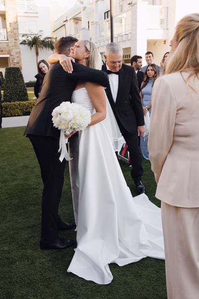 Bride hugging groom at Lido House wedding ceremony