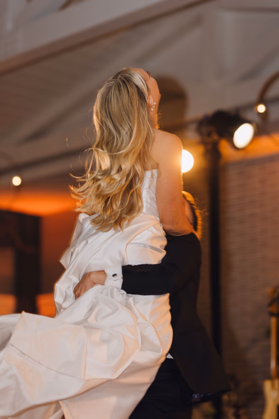 Bride being lifted in the air during lively wedding celebration at Lido House