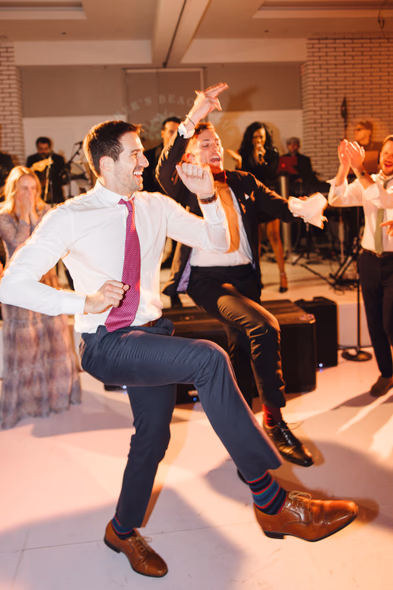 Lively wedding guests dancing at Lido House reception