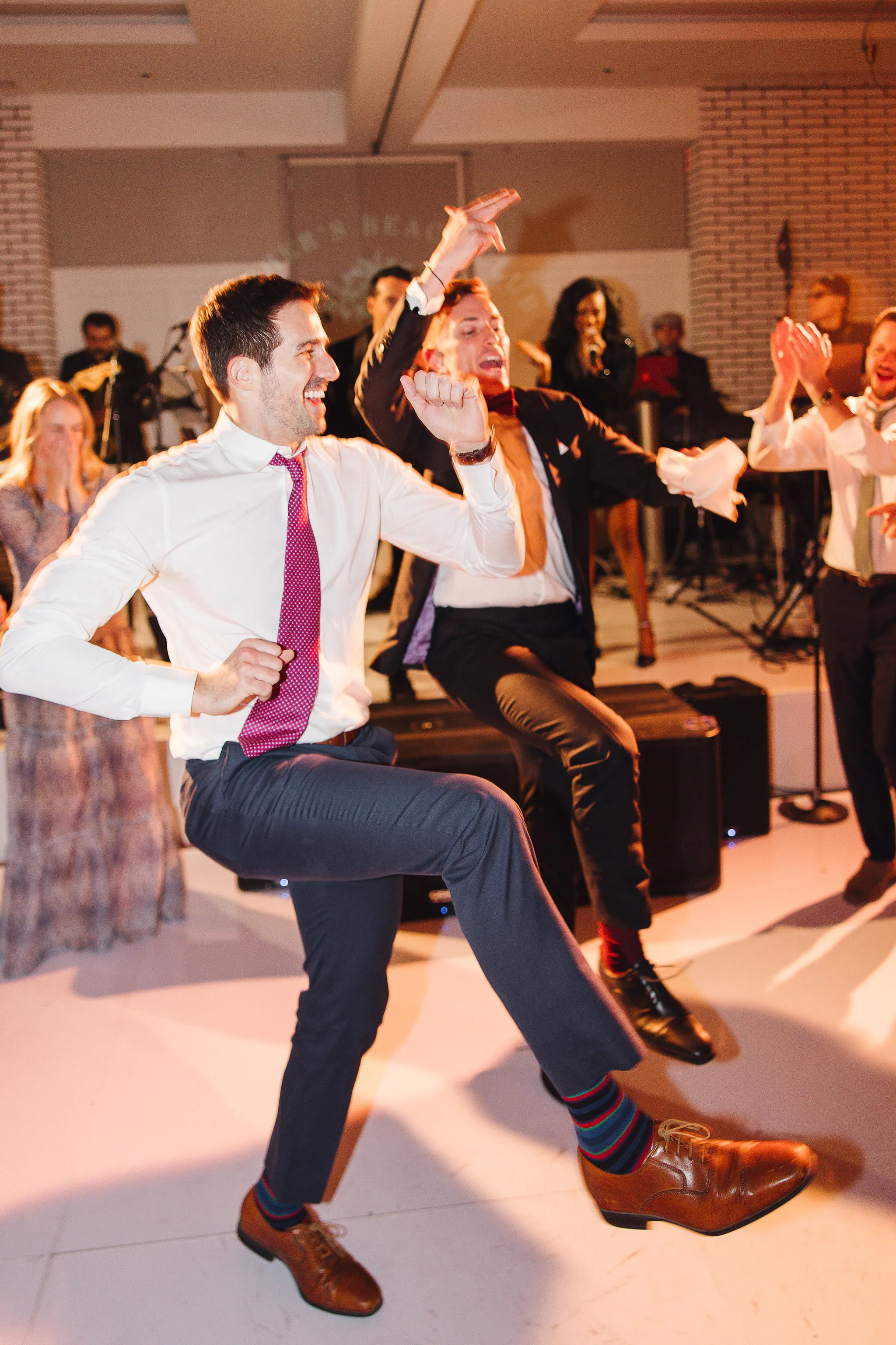 Lively wedding guests dancing at Lido House reception