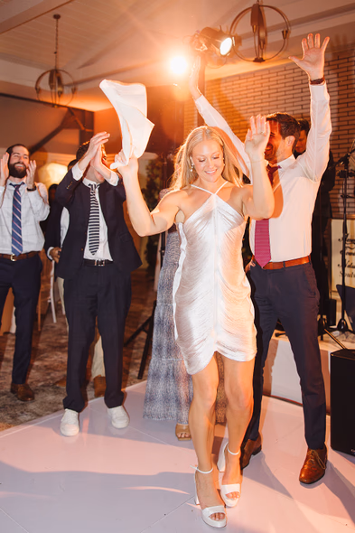 Bride and groom celebrating on the dance floor at Lido House wedding