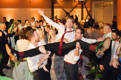 Guests having fun on the dance floor at Lido House wedding