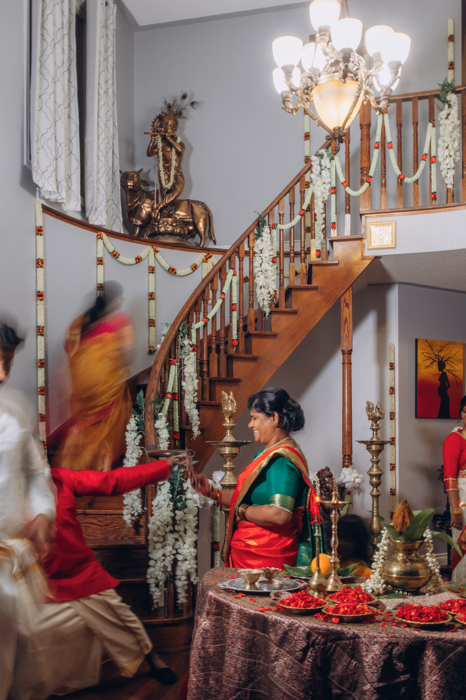 Tamil wedding pre-ceremony at home with traditional décor and family members in sarees