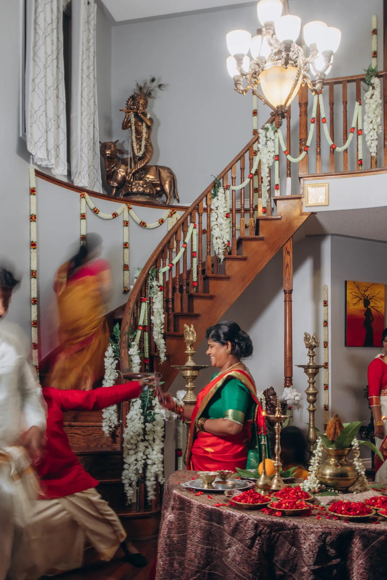 Tamil wedding pre-ceremony at home with traditional décor and family members in sarees