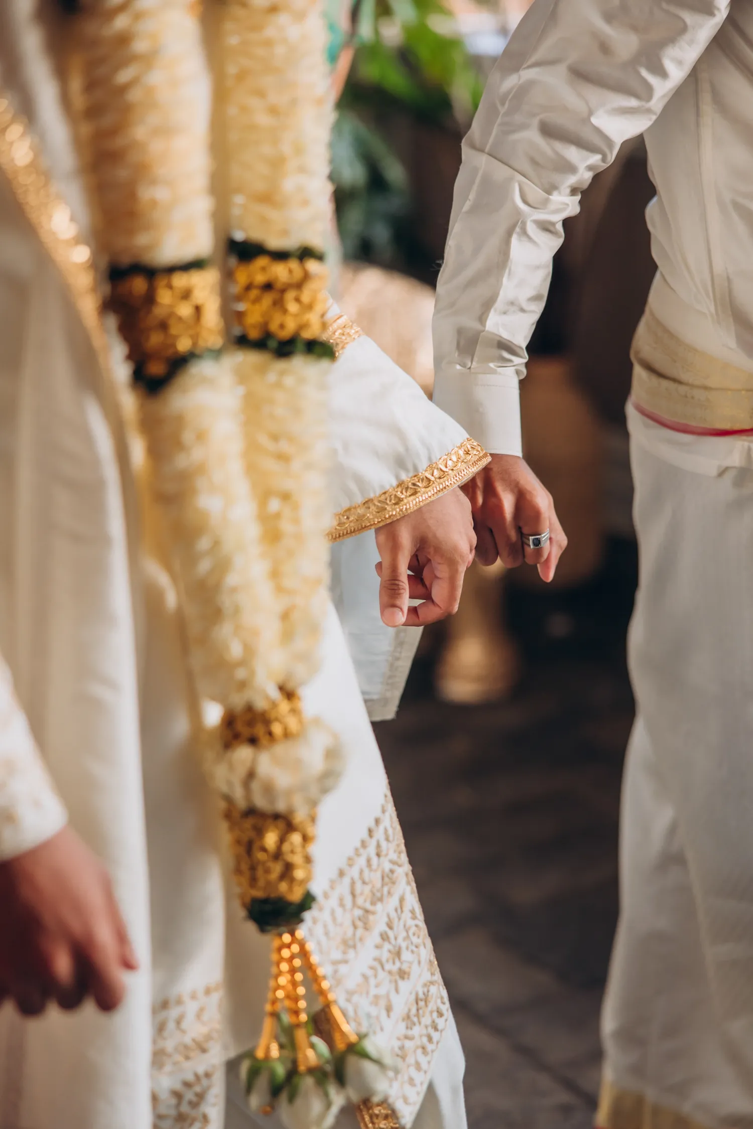 Close-up of hands during Tamil wedding ritual at Madison Greenhouse
