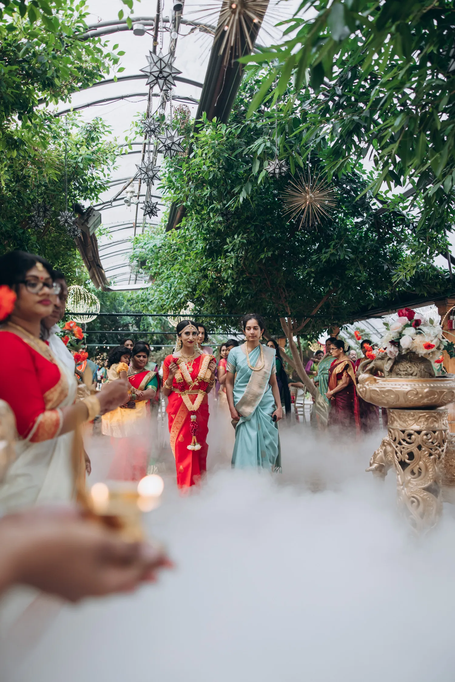 tamil bride enters the aisle in Madison Greenhouse