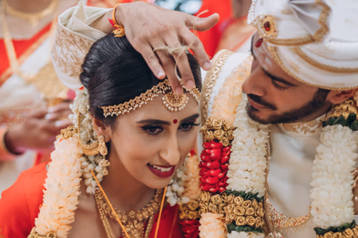 Joyful bride during Tamil wedding photography session in Toronto greenhouse venue