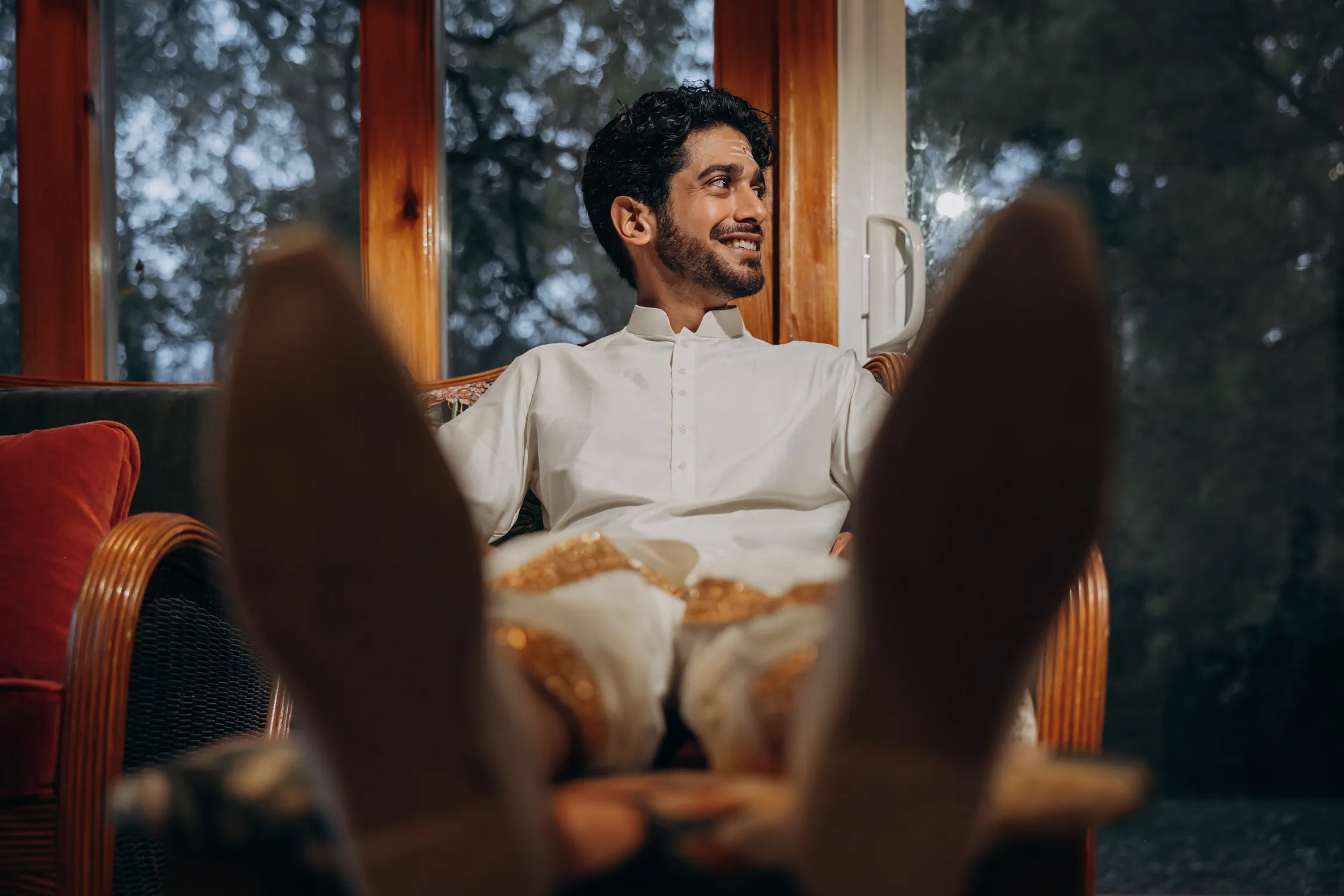 Groom relaxing before Tamil Hindu wedding at Madison Greenhouse venue