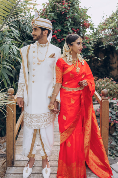 Couple walking together in traditional attire at Tamil wedding at Madison Greenhouse venue