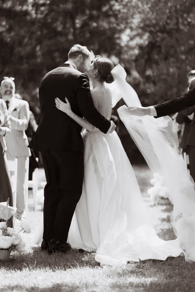 black and white ceremony kiss bride and groom candid wedding moment