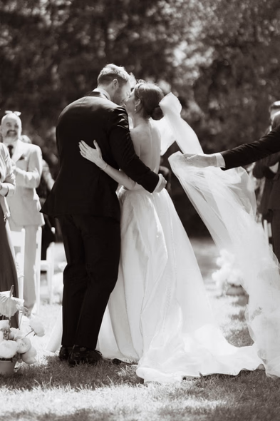 black and white ceremony kiss bride and groom candid wedding moment