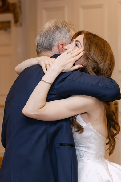 emotional hug bride and father candid wedding reception moment