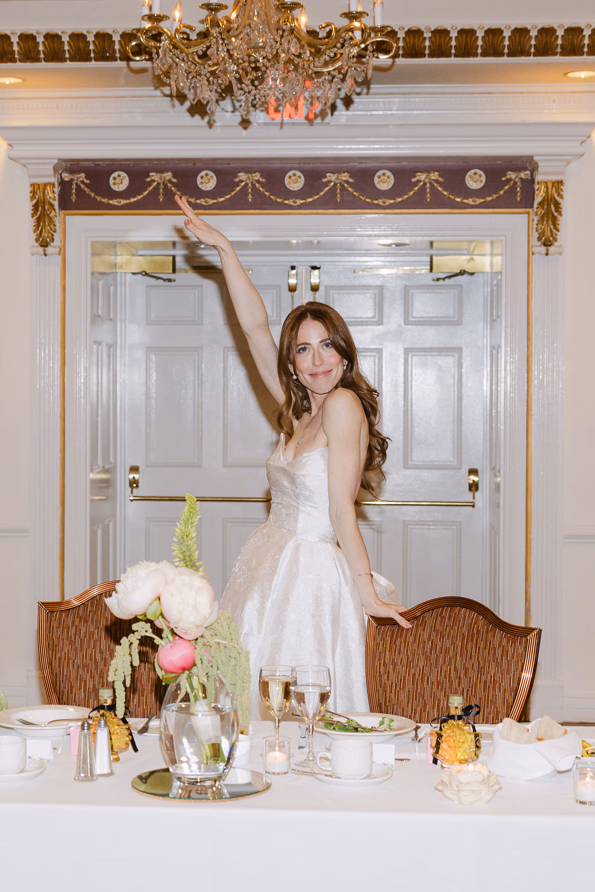 bride posing at sweetheart table floral decor Imperial Ballroom wedding