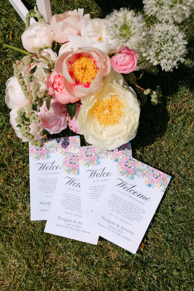 wedding invitation suite and bridal bouquet flat lay Queen’s Landing Niagara-on-the-Lake wedding photography