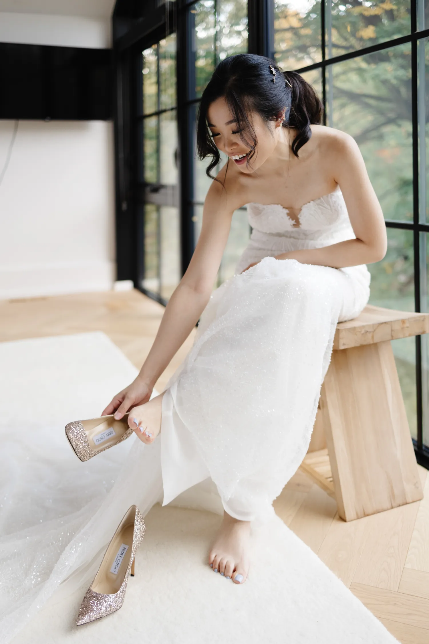 Bride putting on sparkly shoes