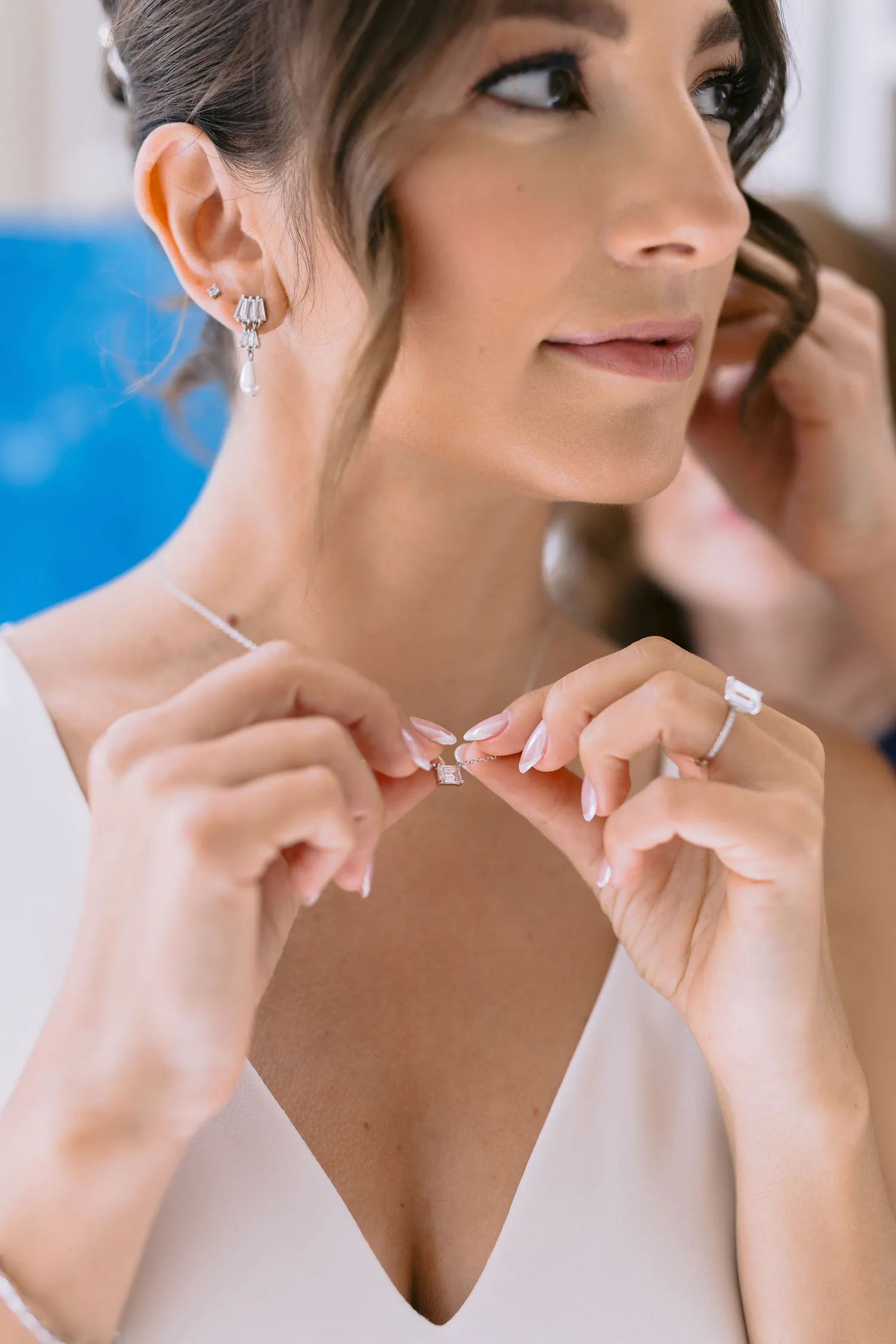 Bride getting ready, gown details shown